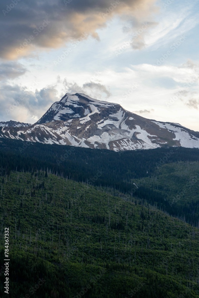 Amazing shot of a mountain covered in snow in Glacier National Park in Montana, USA