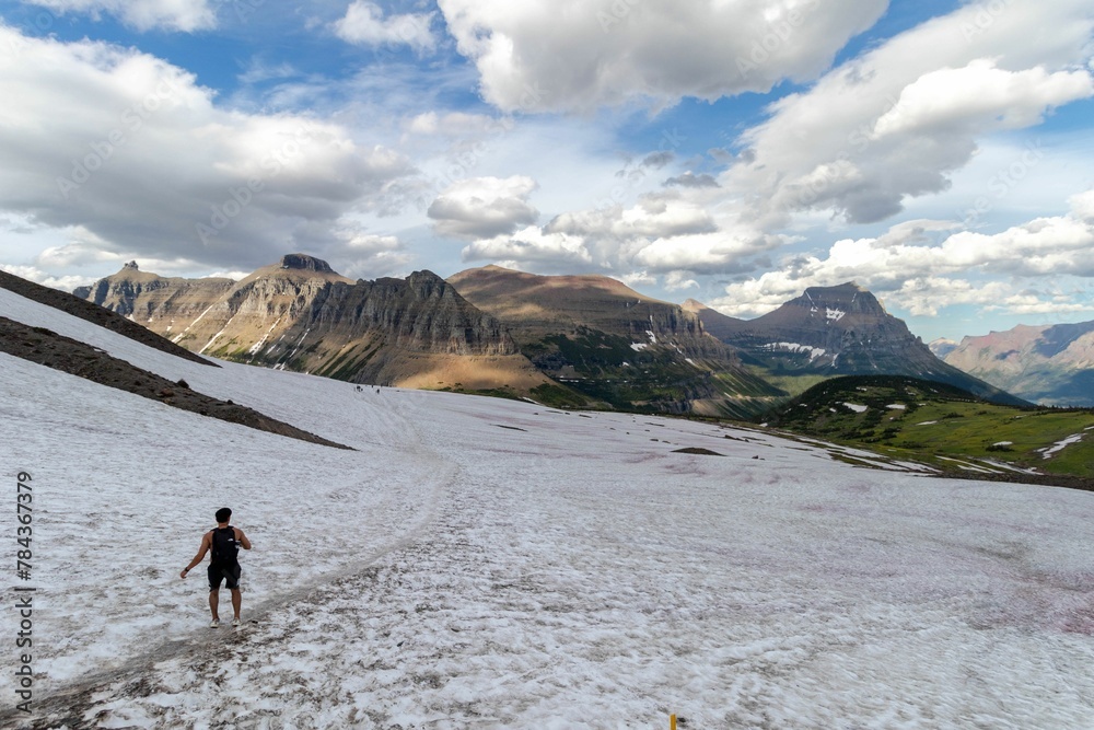 High-angle view of a man walking in the mountains in Glacier National Park, USA