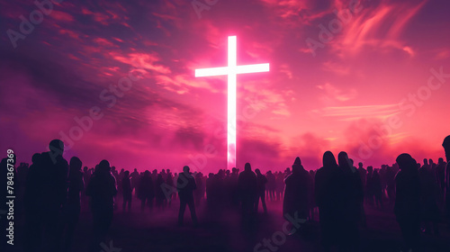 Silhouette of a crowd or group of people standing under the white light glowing cross on the pink and orange sunset sky. Christian religious faith sign and symbol, believe forgiveness,church community