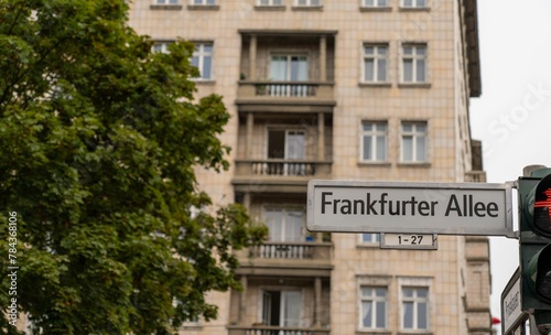 Road sign of Frankfurter Alley on the background of a beige building in Berlin, Germany