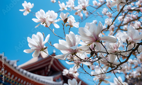 A white magnolia tree blooms in front of the temple  Generative AI