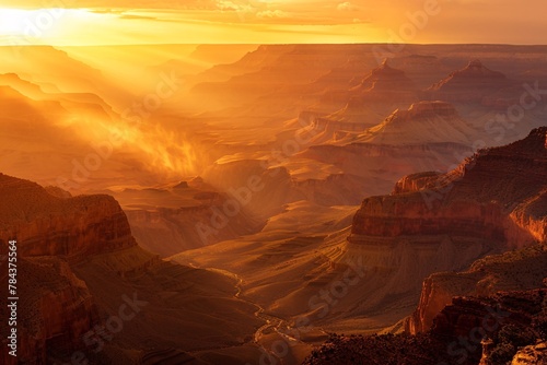 The sun dips below the horizon, casting a warm golden light over the majestic Grand Canyon © Multiverse
