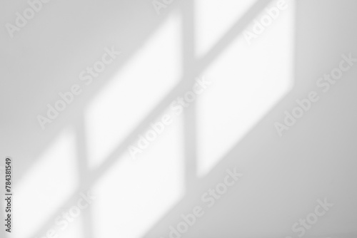 Abstract light reflection and grey shadow from window on white wall background, dark gray shadows and sunshine overlay effect for backdrop and mockup design
