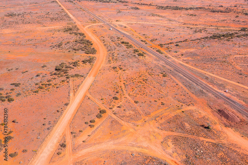 the criss cross of tracks, roads and railway line in arid central australia photo