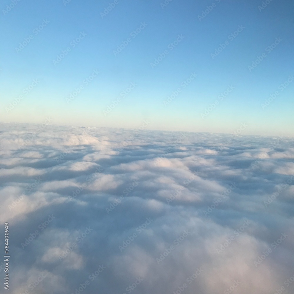 above the clouds high in the sky, a beautiful view at the plane.