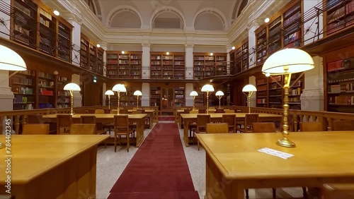 Classic/Historic Reading Room in Library with Rows of Wooden Tables and Lamps indoor aerial fpv drone footage photo