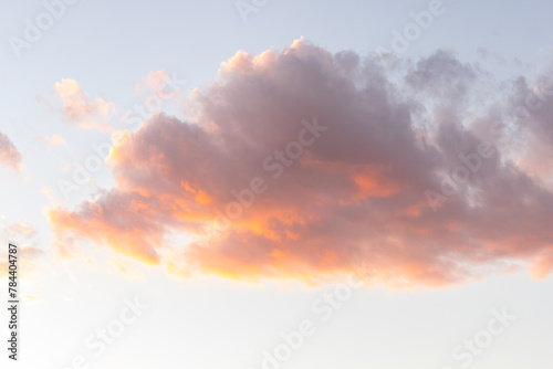 one cloud floating in the sky at sunset photo
