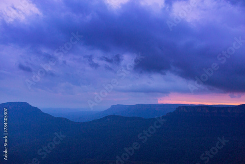 Purple blue storm clouds at sunset over Jamison Valley photo