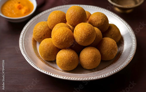 Indian sweets besan laddu kept in a plate.