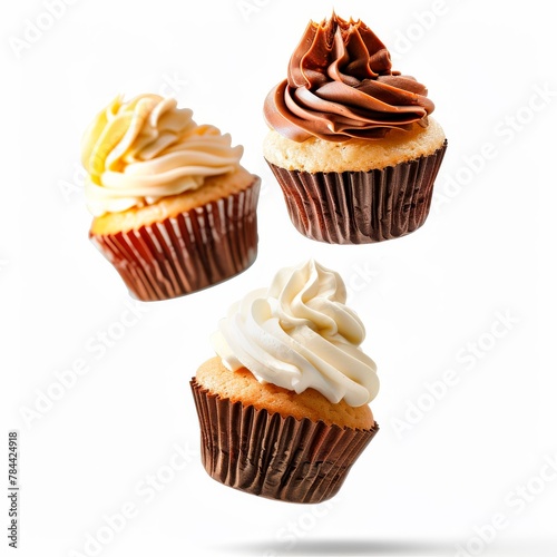 cupcakes floating in the air, isolated on a white background 
