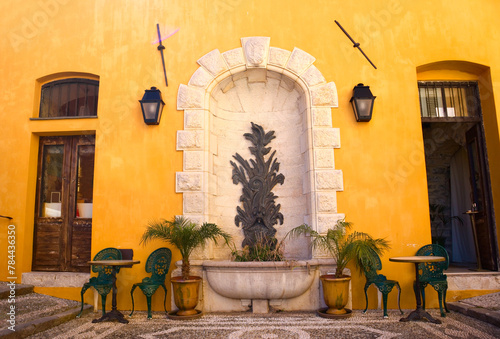  Vintage fountain in downtown in Menton, France