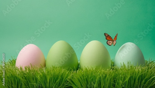 Green Easter eggs and holiday symbols paper art elements grass flowers butterflies Isolated on a isolated pastel background