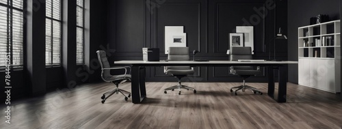 A monochrome photo showcases a laminate flooring office with grey tints and shades, minimalist furniture, and a contemporary workspace aesthetic.