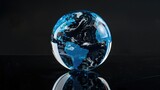 A glass globe resting on a table, suitable for travel or education concepts