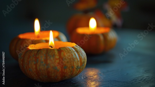 Group of small pumpkins with lit candles  perfect for Halloween decorations