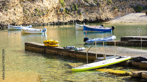 Boats at anchor at the Inland Sea , Dweijra, on the Mediterranean island of Gozo, in the Maltese archipelago 