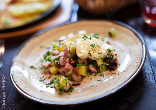 Salad with potatoes, sour cream and mushrooms