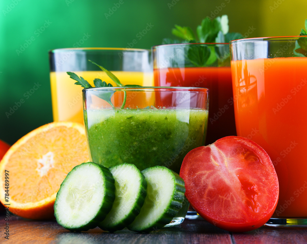 Glasses with fresh organic vegetable and fruit juices Glasses with fresh organic vegetable and fruit juices