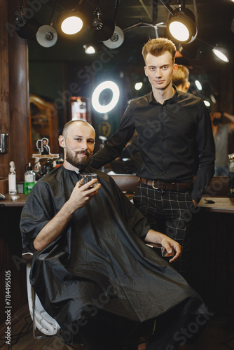 Stylish man sitting in a barbershop