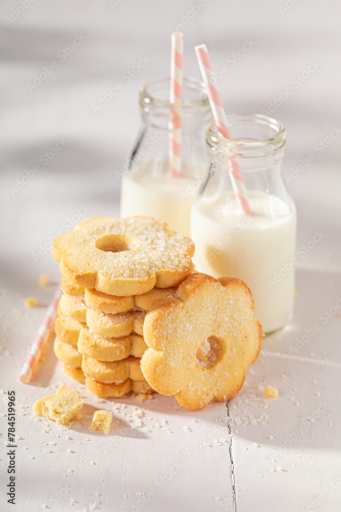 Crunchy and sweet butter cookies served with milk in bottle. Crunchy and sweet butter cookies served with milk in bottle.