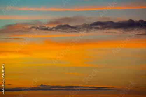 Early morning sky with multicolored clouds © Adilson