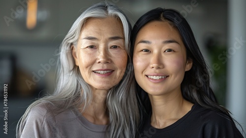 family Asian women girls gray-haired mother and brunette daughter