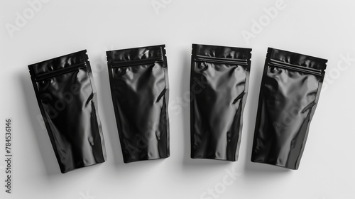 Four black plastic bags with zippers