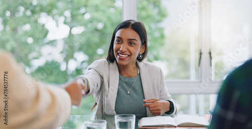 Business woman, handshake and interview thank you with success and agreement in office. Happy, hiring and female professional at company with motivation and shaking hands with job introduction