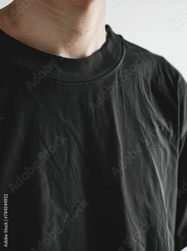 CloseUp Portrait of Man in Black TShirt on White Background, Fashion Concept for Men's Clothing Stores