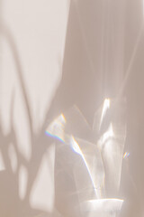 Sunlight background, abstract backdrop with light and shadow, glare and shine on paper texture, rainbow flare, beige color trend aesthetic wallpaper. Natural beams light, caustics effect