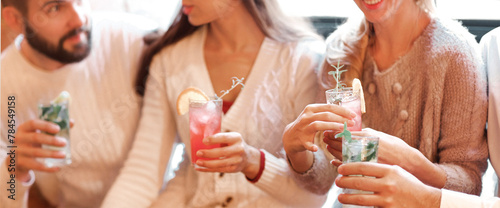 Photography Young men and women drinking cocktail at party