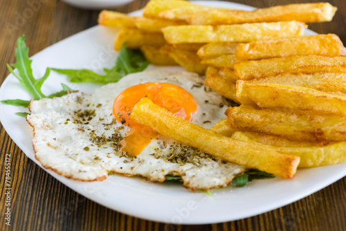 fries with fried eggs