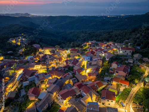 Aerial drone view of traditional Episkepsi village in north corfu,Greece by night, Summer time photo