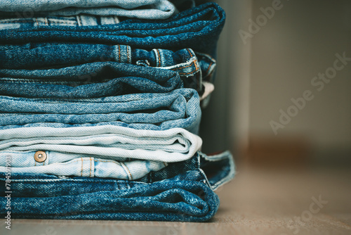 Stack of folded denim pants. Fashion, style, stock and store concept.