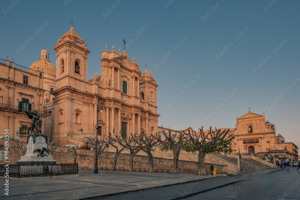 The main street and the main square of the baroque city of Noto under sunset light, Syracuse province, Sicily, Italy