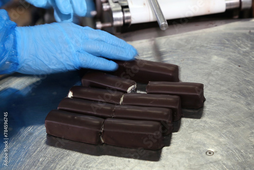 Quality control inspection of chocolate bars on production line