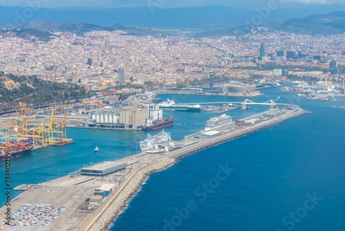 An aerial view of Barcelona's seaport, sea and cityscape.