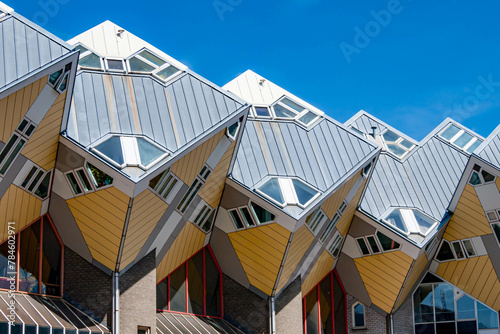 Cube houses or Kubuswoningen, modernist construction seen from lower angle, cube at 45° angle on hexagonal-shaped pillars, sunny day in city of Rotterdam, Zuid-Holland, Netherlands