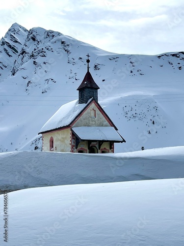 a little mountain church in snowy landscape