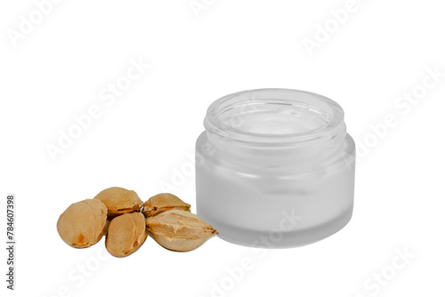 Moisturizer and apricot kernels on a white background. Apricot moisturizer. Skin care product with apricot kernel. Blank white tube for skin care product.