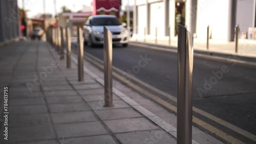 Close-up of bollards placed along the road. Metal road bollards. Road bollards made of metal. photo