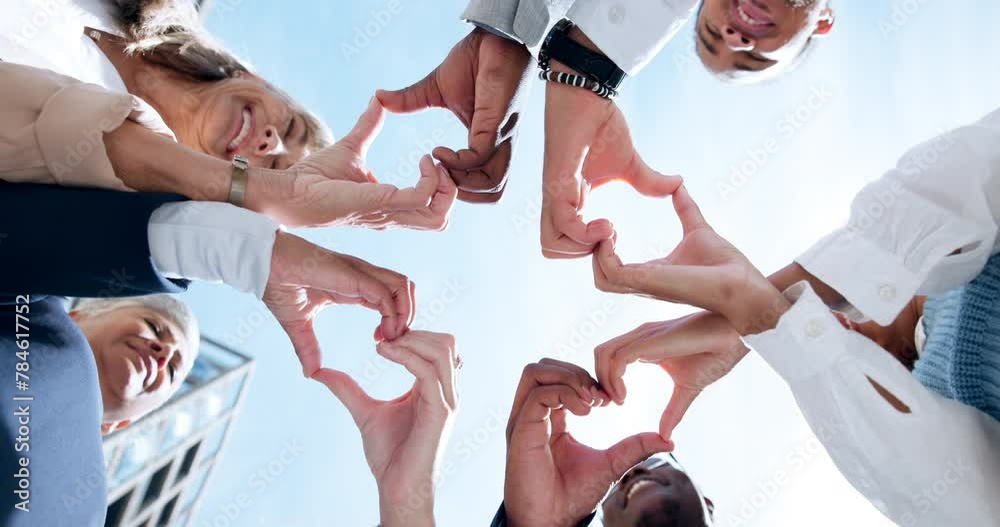 Love, support or business people with heart hands, care gesture or sky in community collaboration. Low angle, health or group of employees with teamwork, wellness symbol or thank you sign outdoors