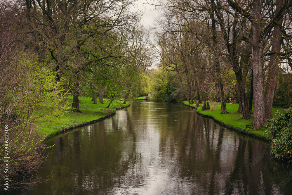 Water flowing through a small local park in Bruges, Belgium Water flowing through a small local park in Bruges, Belgium