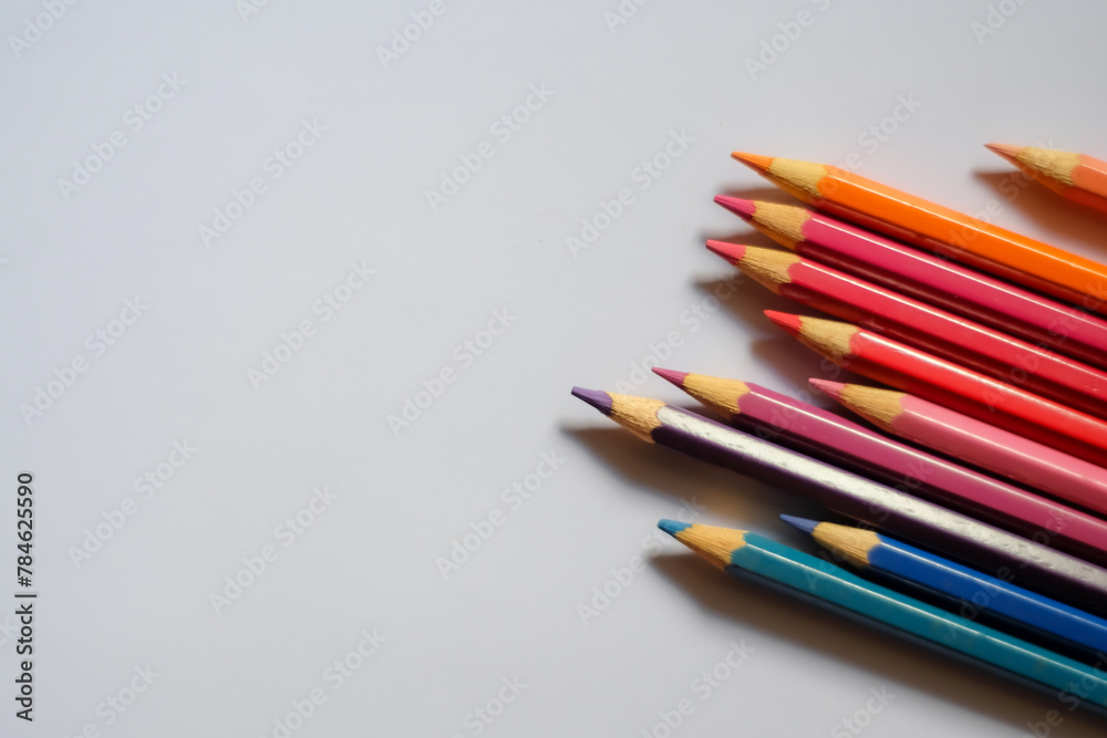 Beautiful colour pencils use as background with copy space. Color pencils isolated on white background close up with Clipping path.