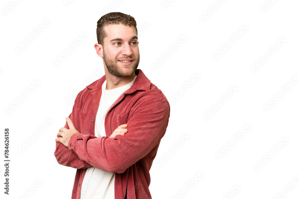 Obraz premium Young handsome blonde man over isolated chroma key background with arms crossed and happy