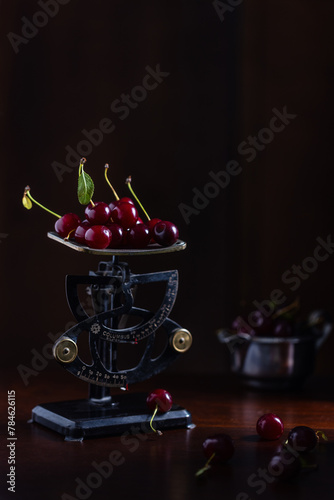 Still life with cherries and the old scaless