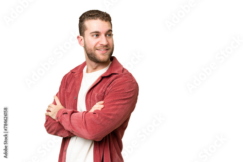 Young handsome blonde man over isolated chroma key background with arms crossed and happy