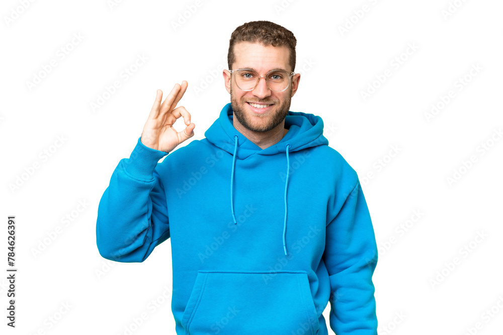 Young handsome blonde man over isolated chroma key background showing ok sign with fingers Young handsome blonde man over isolated chroma key background showing ok sign with fingers