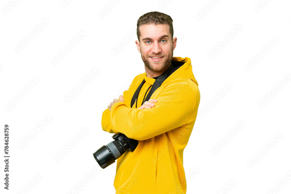 Young photographer man over isolated chroma key background with arms crossed and looking forward Young photographer man over isolated chroma key background with arms crossed and looking forward