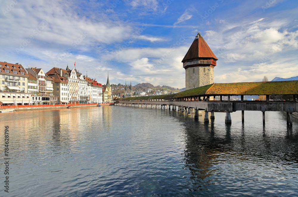 Marvelous historic city center of Lucerne with the old wooden Chapel Bridge (Kapellbruecke) and the old Water Tower (Wasserturm). Lucerne, Switzerland, Europe. 